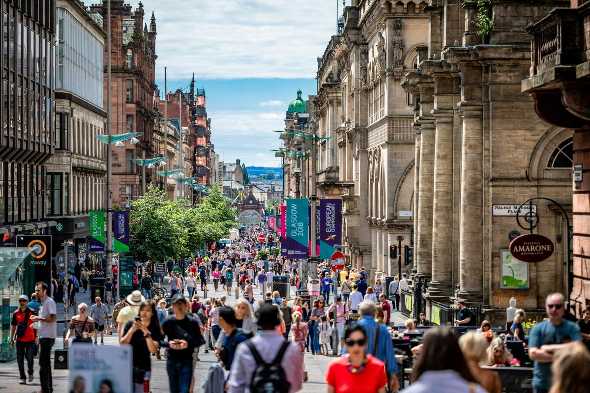 Crowds pass through Glasgow's vibrant city centre.